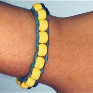 Yellow beads with blue bands bracelet
